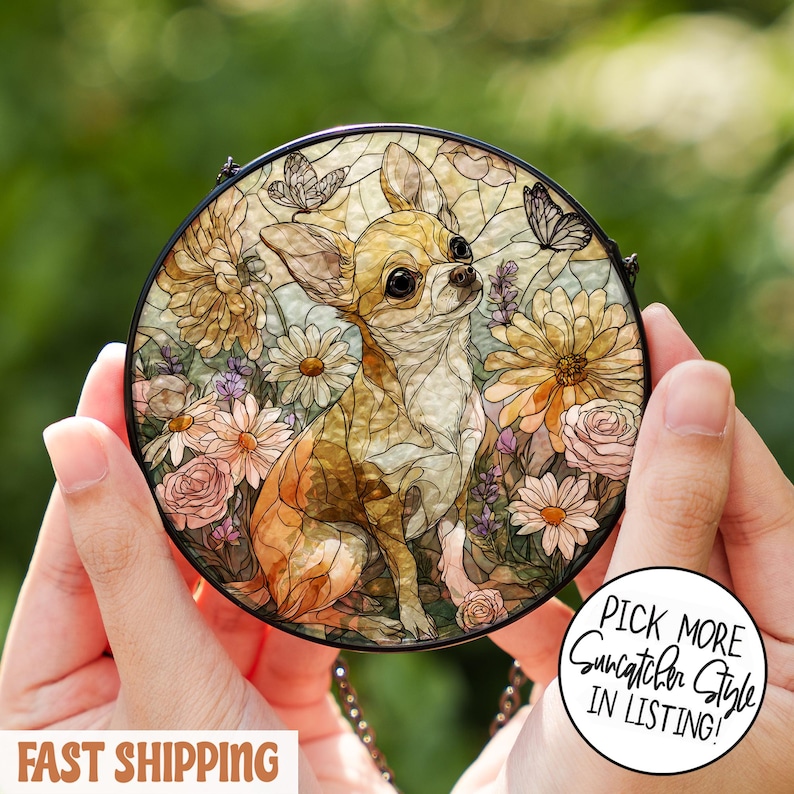 May include: Round stained glass suncatcher featuring a Chihuahua dog surrounded by flowers and butterflies. The artwork has a black border and is held by hands. The text "Pick More Suncatcher Style In Listing!" is visible.