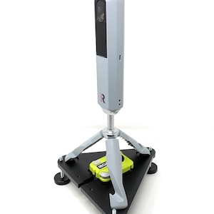 May include: A silver 3D scanner mounted on a black tripod with a green and black base. The scanner has a black lens and a red "Redbird" logo.