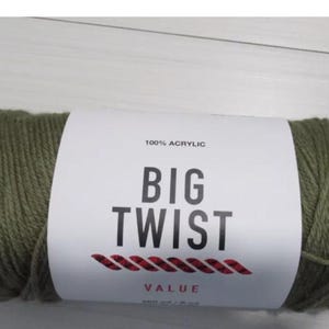 May include: A skein of green yarn labeled "BIG TWIST" 100% Acrylic Value.