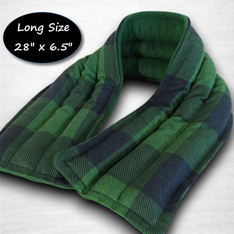A long green and black plaid microwavable hot or cold neck wrap with the text 'Long Size 28' x 6.5' printed on a black circle.