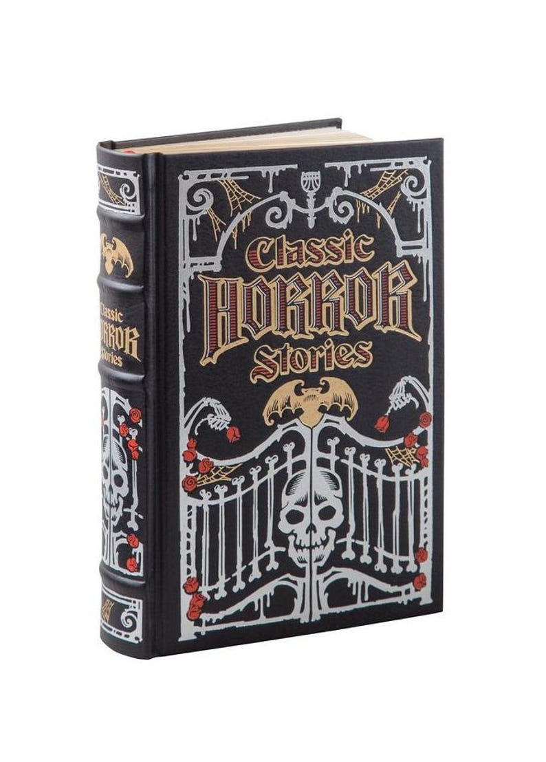 May include: A black book with a silver and gold design. The title is "Classic Horror Stories" with a skull and bat design.