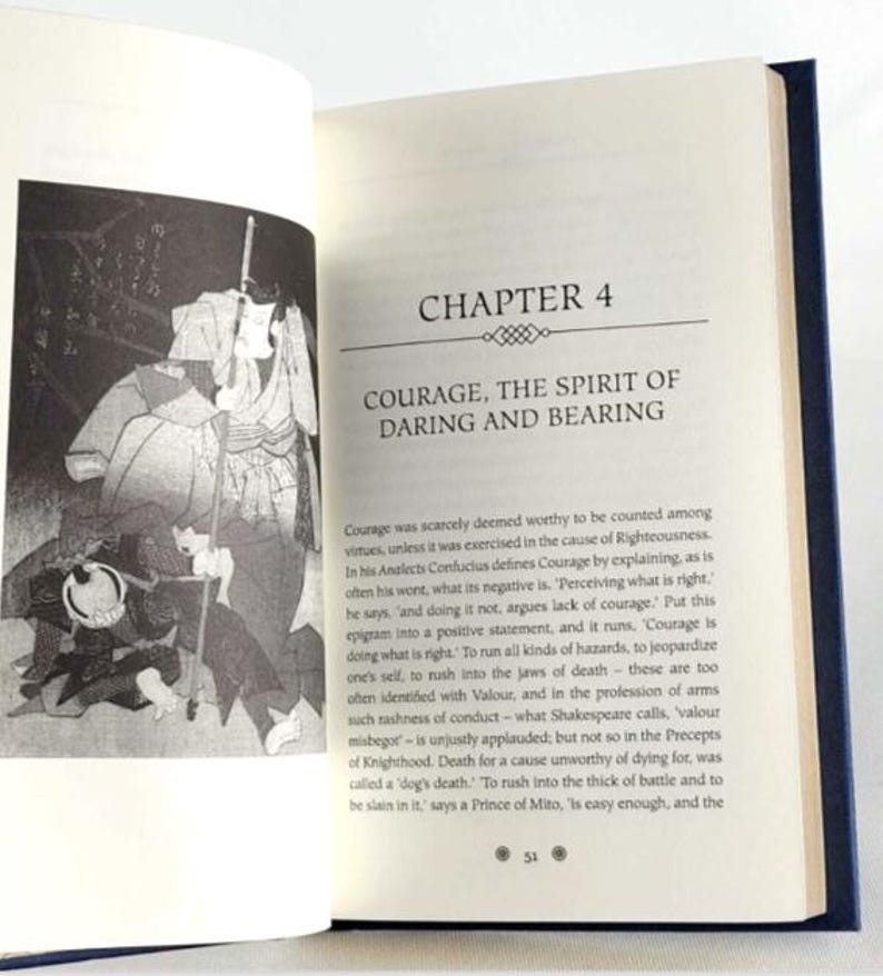 May include: Open book with a black and white illustration of a samurai warrior on the left page. The right page has the title "Chapter 4 Courage, The Spirit of Daring and Bearing" and text about courage in the cause of righteousness.