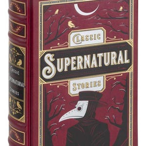 May include: A red hardback book with gold accents and the title "Classic Supernatural Stories". The cover features a black and white illustration of a person wearing a plague doctor mask and a dark hooded cloak.