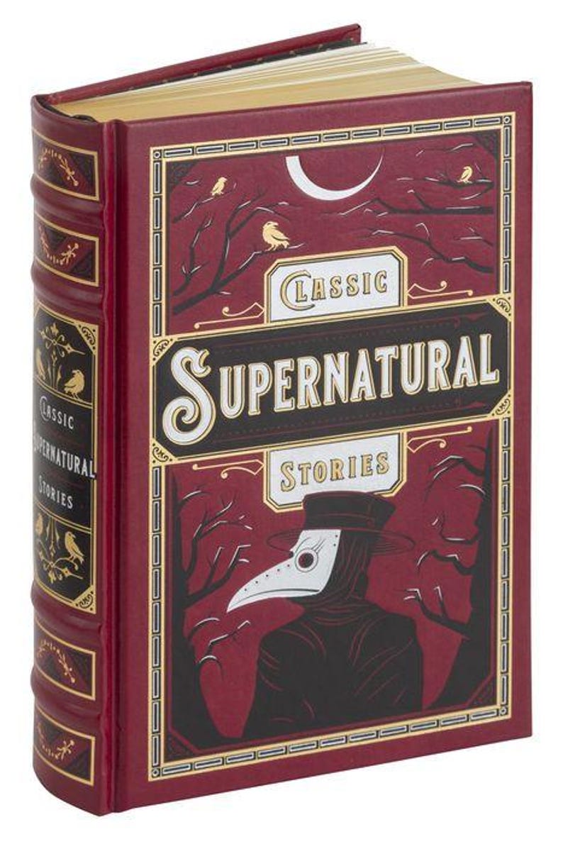 May include: A red hardback book with gold accents and the title "Classic Supernatural Stories". The cover features a black and white illustration of a person wearing a plague doctor mask and a dark hooded cloak.