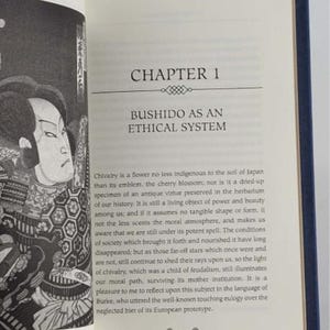 May include: A black and white illustration of a samurai warrior in traditional Japanese clothing. The text "Chapter 1: Bushido as an Ethical System" is printed above the illustration.