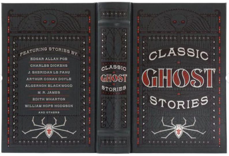 May include: A black hardcover book with a red and white title "Classic Ghost Stories". The cover features a spider with a red skull and crossbones on its back. The spine of the book lists the authors of the stories, including Edgar Allan Poe, Charles Dickens, and J. Sheridan Le Fanu.