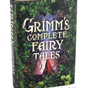 May include: A hardcover book titled "Grimm's Complete Fairy Tales." The cover features a forest scene with green foliage and the title in large, white letters. A figure in a red cloak is visible in the background.