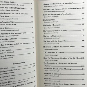 May include: Open book with a table of contents titled "Prophecies & Oracles: Myths & Tales." The contents list various myths and folktales from around the world, including Japanese, Persian, and Celtic mythologies. The pages are off-white.