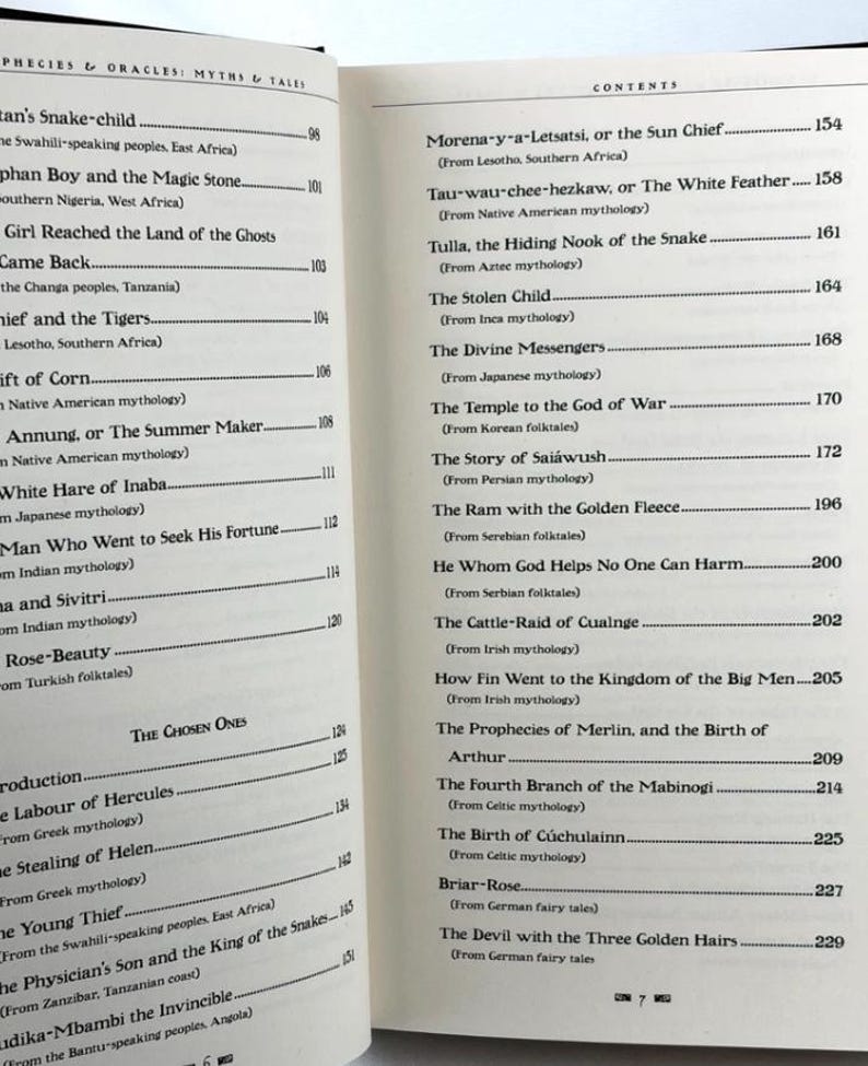 May include: Open book with a table of contents titled "Prophecies & Oracles: Myths & Tales." The contents list various myths and folktales from around the world, including Japanese, Persian, and Celtic mythologies. The pages are off-white.