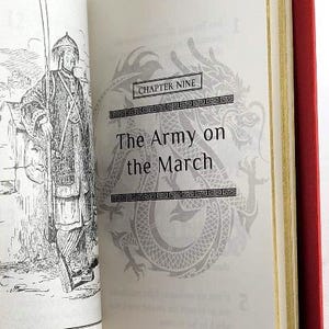 May include: A black and white illustration of a person in a traditional Chinese outfit standing in front of a building. The text "Chapter Nine The Army on the March" is printed on the page.