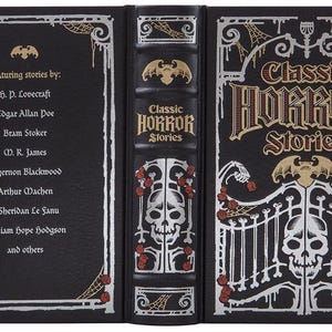 May include: A black hardcover book with a silver and gold design. The book is titled "Classic Horror Stories" and features stories by H.P. Lovecraft, Edgar Allan Poe, Bram Stoker, M.R. James, Algernon Blackwood, Arthur Machen, J. Sheridan Le Fanu, William Hope Hodgson, and others.