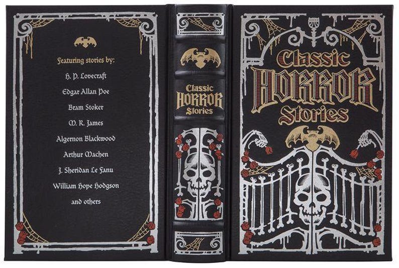 May include: A black hardcover book with a silver and gold design. The book is titled "Classic Horror Stories" and features stories by H.P. Lovecraft, Edgar Allan Poe, Bram Stoker, M.R. James, Algernon Blackwood, Arthur Machen, J. Sheridan Le Fanu, William Hope Hodgson, and others.