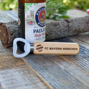 FC Bayern Wood Beer Bottle Opener, engraved on both sides with FC Bayern München on one side and the slogan, Mia San Mia, on the other