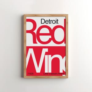 Könnte beinhalten: Ein gerahmtes Poster mit einem roten und weißen Design. Der Text auf dem Poster lautet "Detroit Red Wings /1926 Little Caesars Arena".