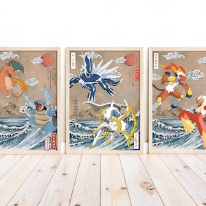 May include: Three framed prints featuring Pokemon characters in a Japanese art style. The prints are set against a wood grain background. The first print features Charizard and Blastoise, the second print features Gyarados and Lugia, and the third print features Arcanine and Entei.