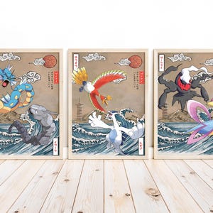 May include: Three framed prints featuring Japanese-style illustrations of Pokemon characters. The prints feature a blue and yellow water Pokemon, a red and white bird Pokemon, and a black and white ghost Pokemon.
