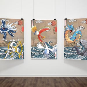 May include: Three Japanese-style prints featuring Pokemon characters. The first print shows a blue and white Pokemon with wings, the second print shows a red and yellow Pokemon with wings, and the third print shows a blue and green Pokemon with a long tail.