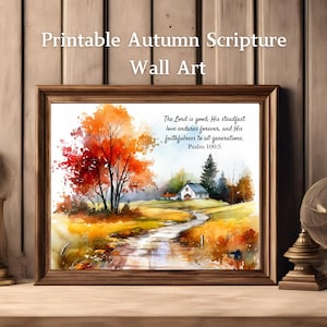 May include: A framed wall art print featuring a watercolor landscape of an autumn scene with a winding path, a small house, and vibrant orange and red trees. The text reads: The Lord is good; His steadfast love endures forever, and His faithfulness to all generations. Psalm 100:5.