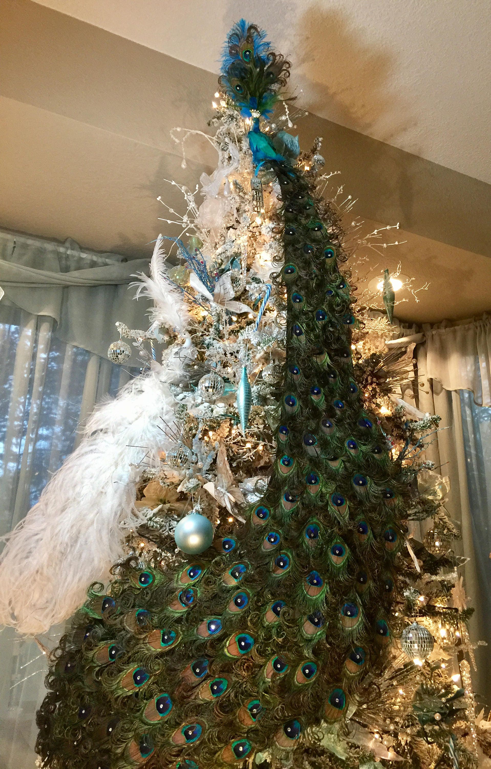 Finished the peacock themed tree, crowned with a life sized