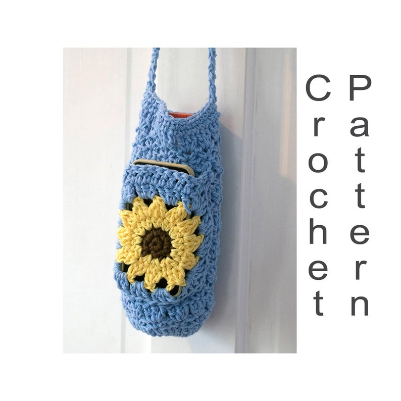 May include: A light blue crocheted bag with a sunflower design. The bag has a pocket on the front and a long strap.