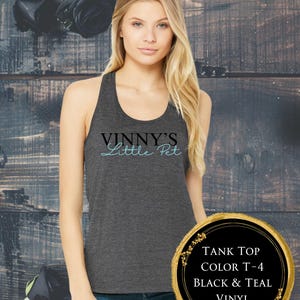 May include: Dark grey tank top with the text "VINNY'S Little Pet" in black and teal. The tank top is part of licensed merchandise. A circular graphic displays "TANK TOP COLOR T-4 BLACK & TEAL VINYL".