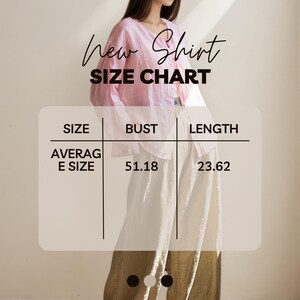 May include: A pink blouse with a V-neck and long sleeves. The image includes a size chart with measurements in inches: bust 51.18 inches, length 23.62 inches. Text on the image reads "New Shirt SIZE CHART".