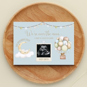 Faire-part de grossesse. Faire-part de grossesse numérique, bleu carte de bébé sur le thème « Au-dessus de la lune ».