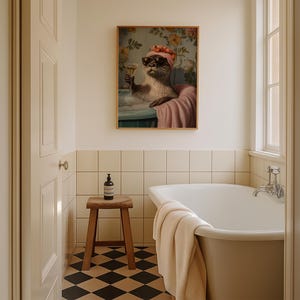 May include: A framed artwork depicts an otter in a bathtub, wearing sunglasses and a floral head wrap, holding a champagne glass. The artwork is in a bathroom setting with a wooden stool, a white bathtub, and a black and white checkered floor.