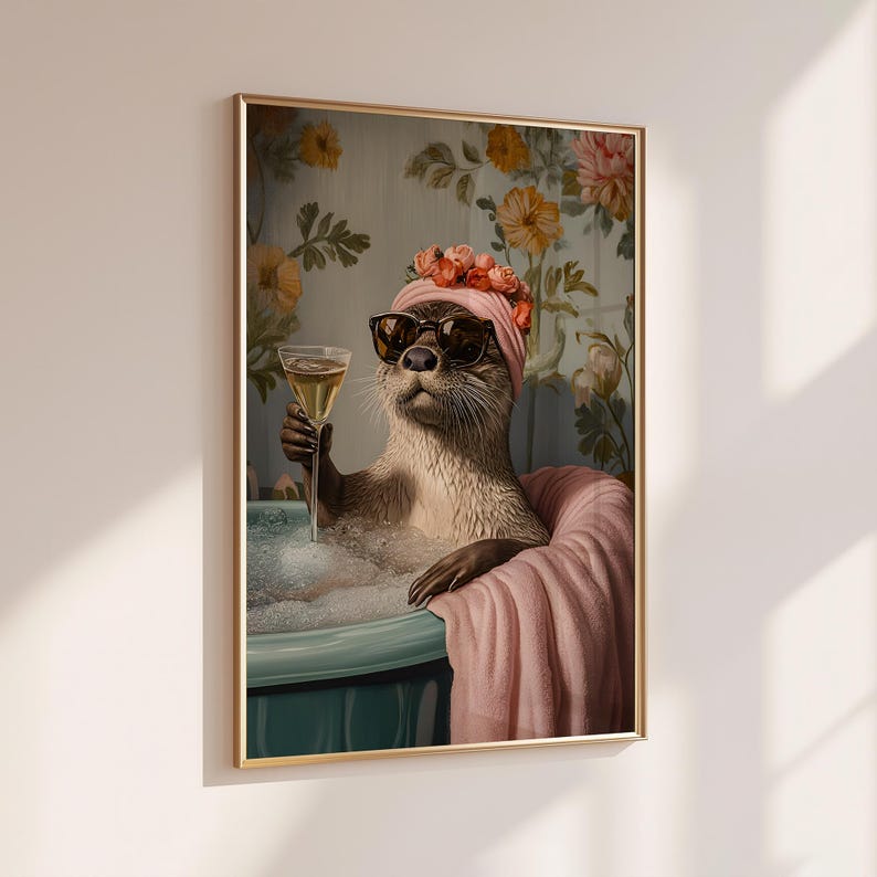 May include: A framed print depicts an otter in a bathtub, wearing sunglasses and a pink head wrap, holding a champagne glass. The otter is surrounded by bubbles and a pink towel, with a floral wallpaper background. The artwork has a whimsical and humorous theme.
