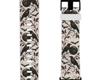 May include: Black and white watch band featuring a repeating pattern of crows, moons, and bats. The design includes dark red vines on a cream background. The watch band has black connectors and a white clasp.