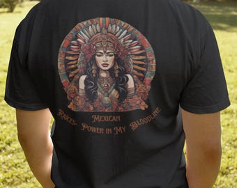 May include: Black t-shirt featuring a detailed illustration of a woman in a feathered headdress, surrounded by floral elements. The text "Mexican Power in My Bloodline" is arched below the image. The design is centered on the back.