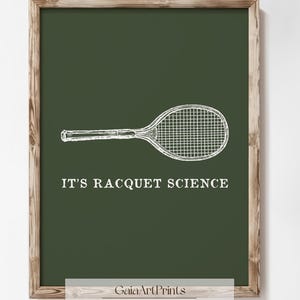 May include: A green background with a white tennis racket and the text "IT'S RACQUET SCIENCE". The text is in a white sans-serif font. The image is framed with a brown wooden frame.