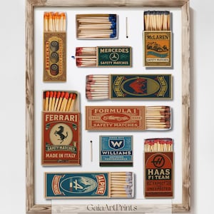 May include: A framed print featuring various vintage matchbox designs. The boxes showcase brands like Ferrari, Mercedes, and McLaren, with text and logos. The matches have red, blue, and orange tips. The print includes the text "GaiaArtPrints Curated Wall Art."