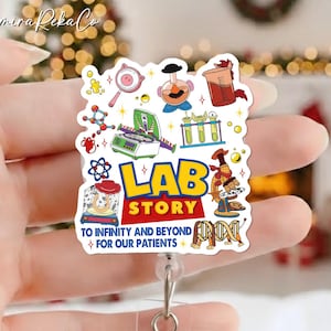 May include: A white badge reel with a colorful "Lab Story" design. The design includes lab equipment illustrations and the text "To Infinity and Beyond For Our Patients". The badge reel has a clear plastic strap and a metal clip.
