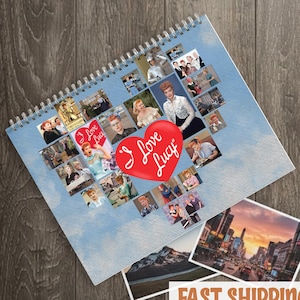 May include: Spiral-bound notebook featuring a heart-shaped collage of images of Lucille Ball, with a red heart that says "I Love Lucy". The notebook is on a blue background with cloud imagery. Additional photos are visible.