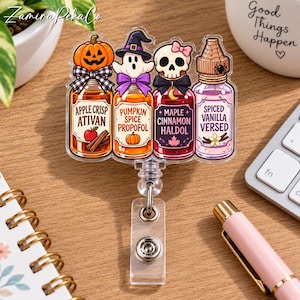 May include: An acrylic badge reel featuring four potion bottles labeled Apple Crisp Ativan, Pumpkin Spice Propofol, Maple Cinnamon Haldol, and Spiced Vanilla Versed. The bottles are topped with a pumpkin, ghost, skull, and spider web cap.