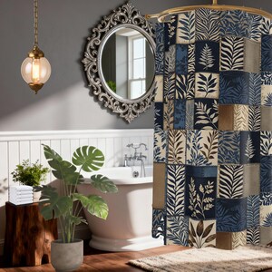 May include: A shower curtain featuring a patchwork design of rectangular panels with various botanical leaf patterns in shades of navy blue, cream, and tan. The fabric displays a repeating arrangement of fern and tropical foliage prints.