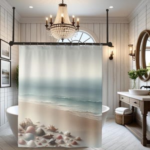 May include: A shower curtain featuring a printed coastal scene with a sandy beach, gentle ocean waves, and a collection of various seashells in shades of white, beige, and soft pink scattered along the foreground shoreline.