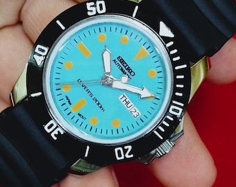 vintage Remis à neuf Seiko 5 automatique japon jour date cadran turquoise lunette tournante travail montre-bracelet 40 mm.