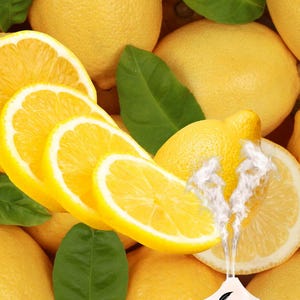 May include: A vibrant image showcasing whole and sliced lemons with green leaves. A diffuser with the text "W a Veney" is emitting a vapor, suggesting aromatherapy or essential oils. The lemons are bright yellow, creating a fresh and citrusy aesthetic.