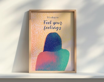 May include: A framed art print with the text "It's okay to Feel your feelings." The artwork features a person's silhouette with a blue head and shoulders, and a body in shades of red and green. The background is a mix of yellow and orange.