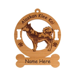 May include: Wooden ornament featuring a silhouette of an Alaskan Klee Kai dog with the text "Alaskan Klee Kai" around the dog and "Name Here" on a bone-shaped tag.