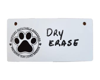 May include: White dry erase board with a black paw print logo that says "Support Reputable Breeders, Preserve Our Loved Breeds". The board also has the words "Dry Erase" written on it.