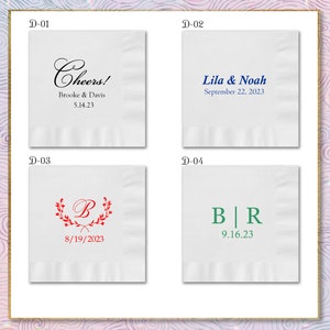 May include: Four white napkins with different designs and text. The first napkin says "Cheers! Brooke & Davis 5.14.23". The second napkin says "Lila & Noah September 22, 2023". The third napkin has a red wreath with a "B" in the center and the date "8/19/2023". The fourth napkin has a blue "B" and a green "R" separated by a vertical line and the date "9.16.23".