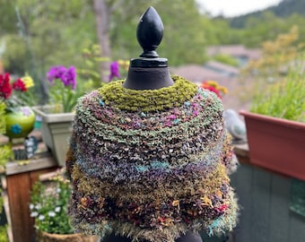 Short (13" neck to hem) olive and earth-toned hand-knitted mini poncho / capelet in acrylic novelty yarns (sku #2026-E-10)