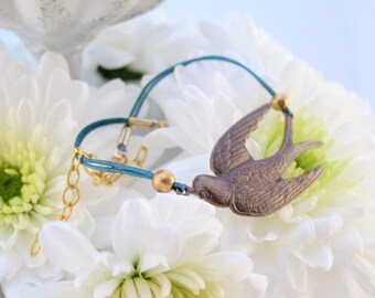 Antique Gold Swallow Bracelet on Turquoise Cord - Fly Away with this Unique Bird Design!