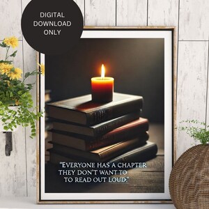 May include: A framed print with a quote about life's chapters. The quote reads "Everyone has a chapter they don't want to read out loud." The print features a stack of books with a lit candle on top.