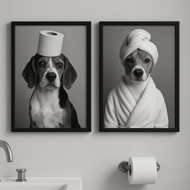 May include: Two framed black and white prints. One shows a beagle with a toilet paper roll on its head. The other print features a beagle wearing a white robe and a towel on its head. The prints are displayed on a gray wall.