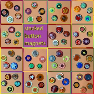 May include: A collection of 16 stacked button magnets, each with a different design and color. The magnets are arranged in a grid on a light brown background. The text "stacked button magnets" is written in purple letters on a yellow background.