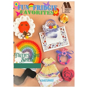 May include: A book cover featuring a rainbow, a crocheted flower, a crocheted basket, a crocheted dress, and a crocheted rose. The book title is "Fun Fridge Favorites" and the subtitle is "Faith's She Shed".